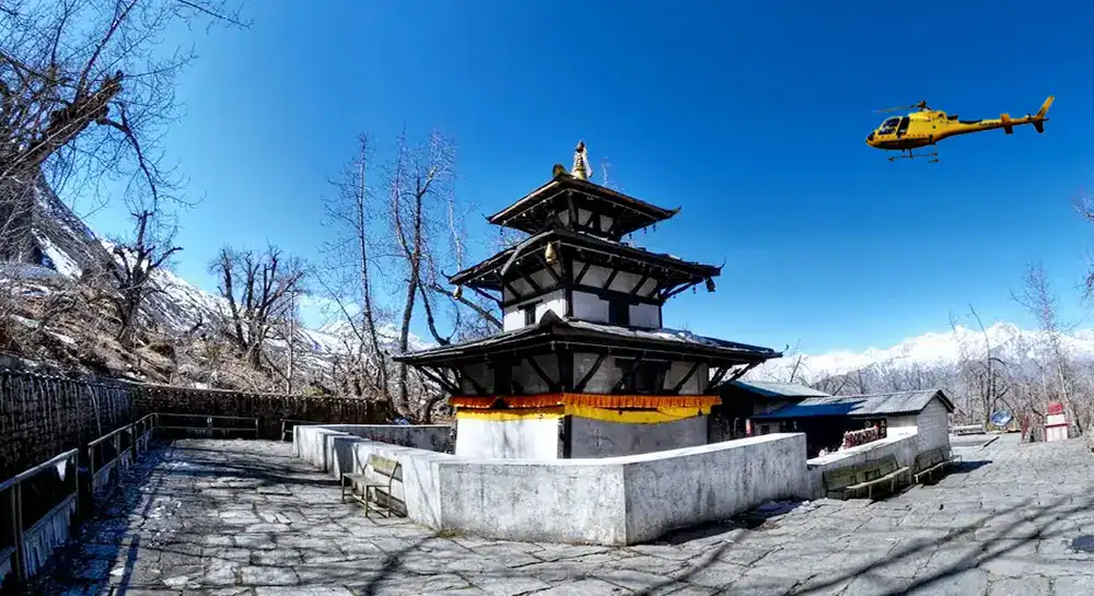 Helicopter flying near Everest Base Camp Heli Tour site in Nepal's Himalayas.