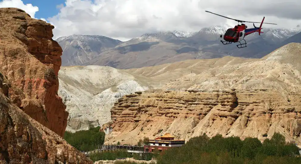 Helicopter over rocky landscape near Everest Base Camp helicopter tour in Nepal.